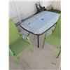Image 1 : Glass-topped patio table and 2 green chairs (5' W, 38" T, 28.5" H)