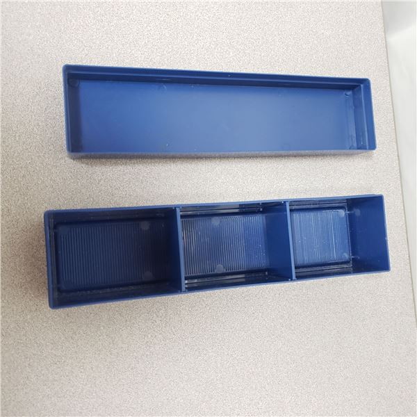 Blue Whitman plastic holder for housing 2X2s.