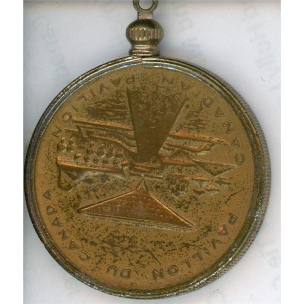 Expo 67 Canadian Pavilion medal. Housed in a bezel.