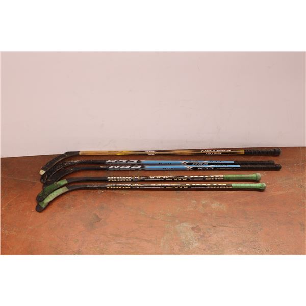 *Five wooden right handed hockey sticks