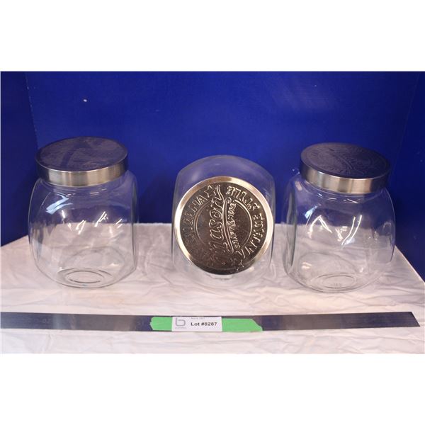 Set of three glass storage jars