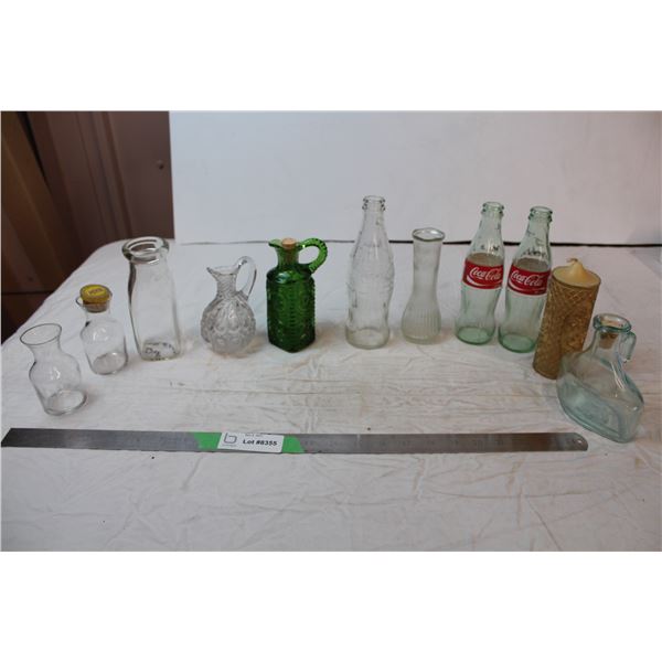 vintage glass bottles, one candle