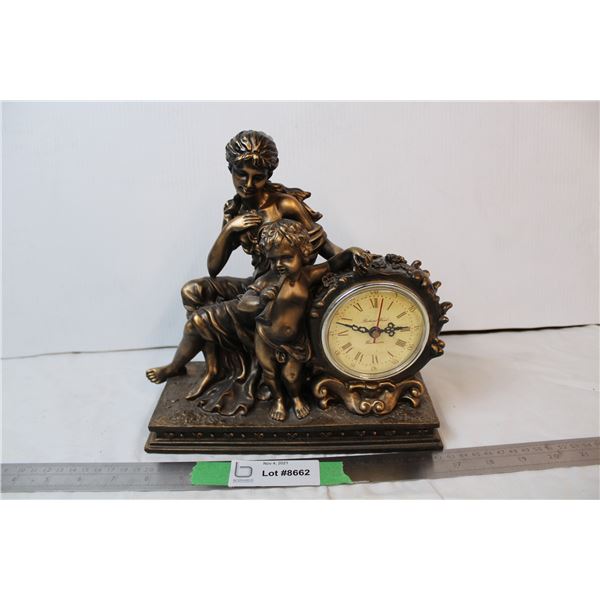 plaster clock with human figures