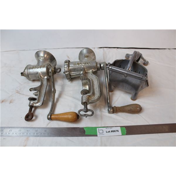 Vintage meat grinders and berry press