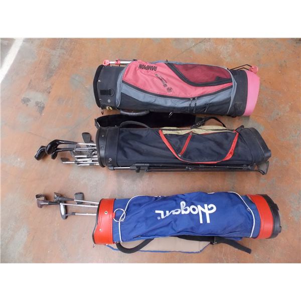 *3 golf bags with clubs