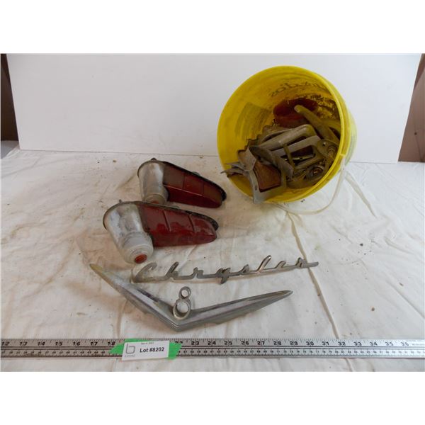 bucket of vintage car parts