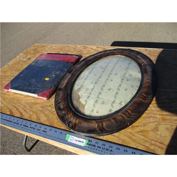 convex glass in frame + book