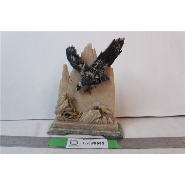 Stone carving, eagle catching snake