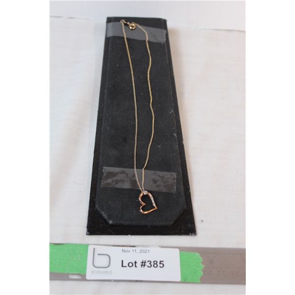 10 kt rose gold pendant and chain (10kt as well) with diamonds