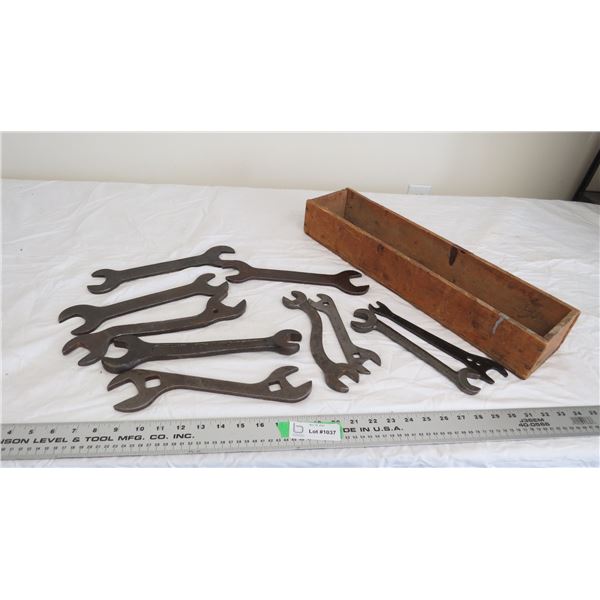 wooden box with vintage wrenches