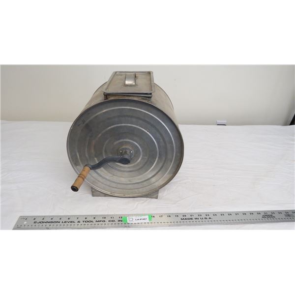 vintage butter churn with wooden paddle