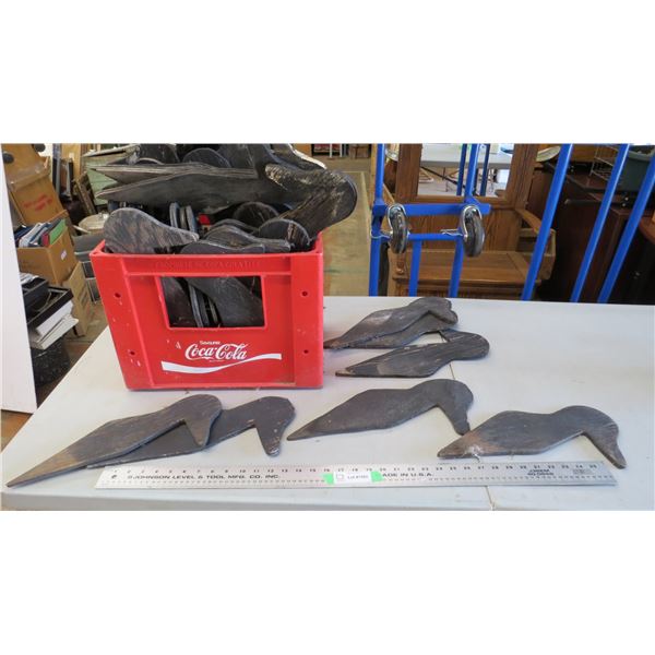 wooden duck decoys in coca-cola plastic crate