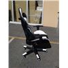 Image 2 : AS NEW BLACK AND WHITE GAS LIFT GAMING CHAIR - cracked casing on right side spring cover
