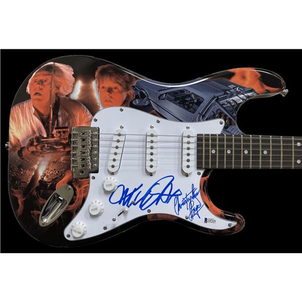 MICHEAL J FOX AND CHRISTOPHER LLOYD 1/1 SIGNED HAND PAINTED BTTF GUITAR ( BECKETT COA)