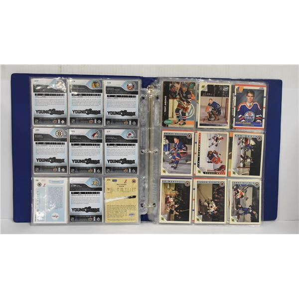 BINDER OF HOCKEY CARDS & COLLECTIBLE STAMPS