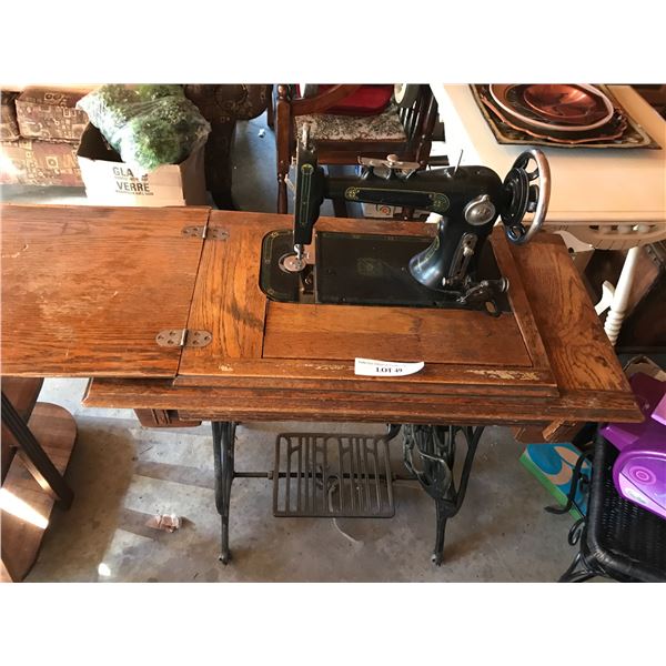 Reliance antique sewing machine with cabinet (made in USA)