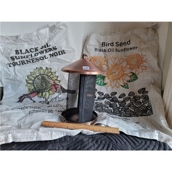 Copper bird feeder & 2 canadian seed bags.