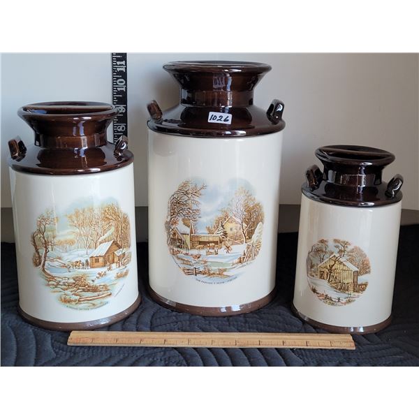 Milk can style canister set by Jenny's Ceramics. Each features a different farm scene.