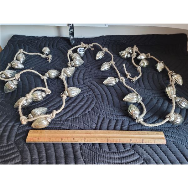 Vintage Kugel style bulb garland features individually tied bulbs on a rope.