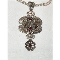 Silver pendant with 3 flowers with  a garnet in#2281030