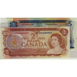 Lot of 2 notes both with low serial numbers.