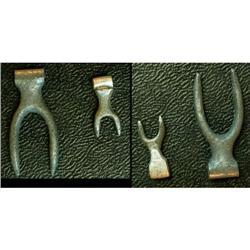 Silver two pronged clip or portion of.  Inclu