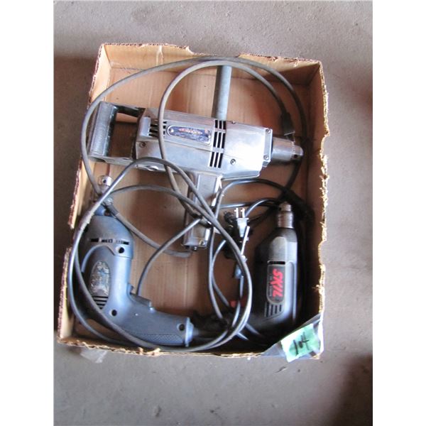 box with 1/2 inch drill-noisy but works, and two other drills