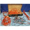Image 1 : old tin suitcase with assorted extension cords