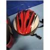 Image 6 : child's booster seat and various helmets
