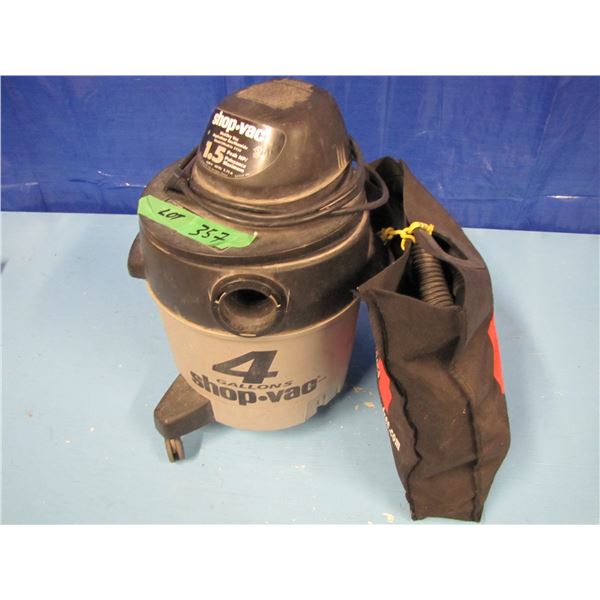 4 gallon shop vac with hose Etc, missing one wheel