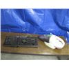 Image 1 : keyboard with headset and small vacuum, vacuum works