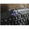 Image 3 : keyboard with headset and small vacuum, vacuum works