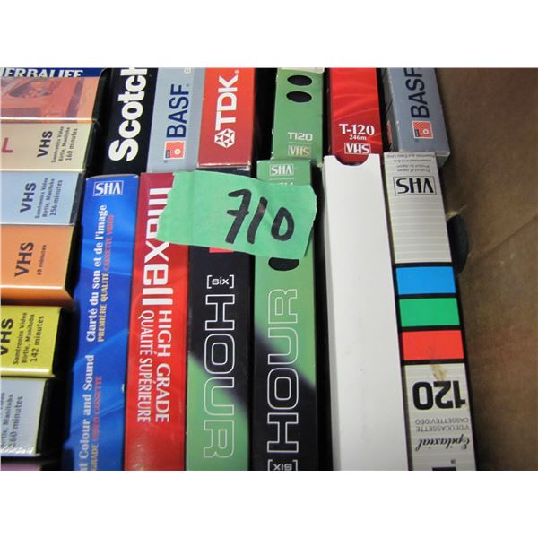 suitcase and box of VHS tapes