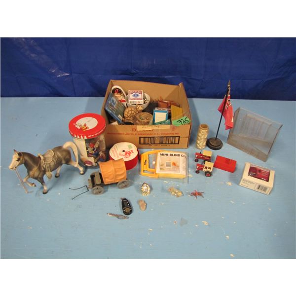 box with buttons, toy horse, toy tractors etcetera
