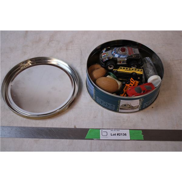 Tin with toy cars, pins, dice, Keychains, wooden eggs