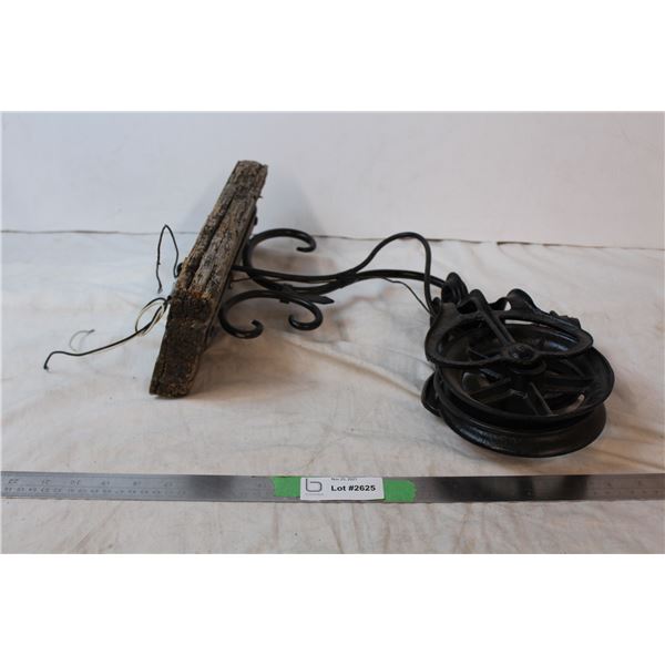 Wall light using vintage pulley