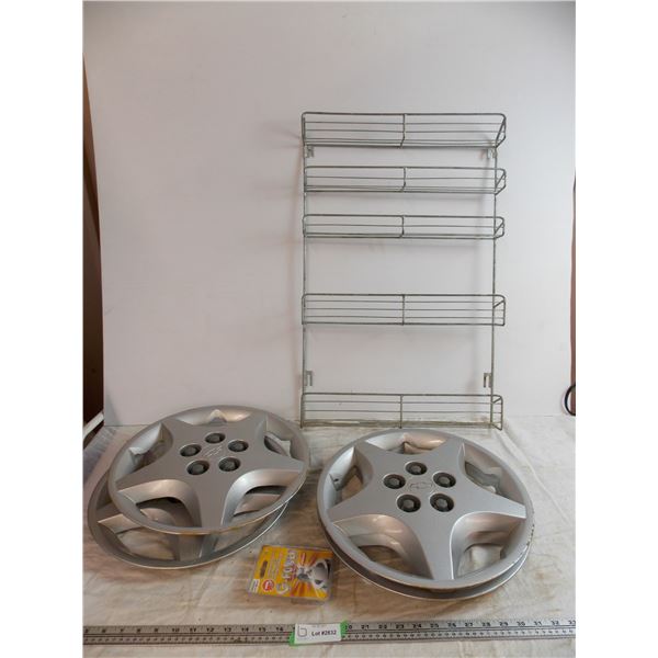 (4) plastic Chevy hubcaps - NGK Sparkplugs, metal display rack