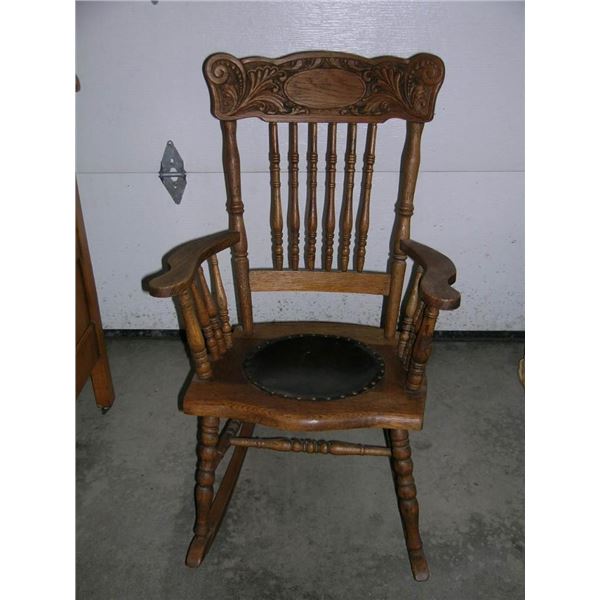Antique Press back leather seat rocking chair - Take this vintage piece of nostalgia home.