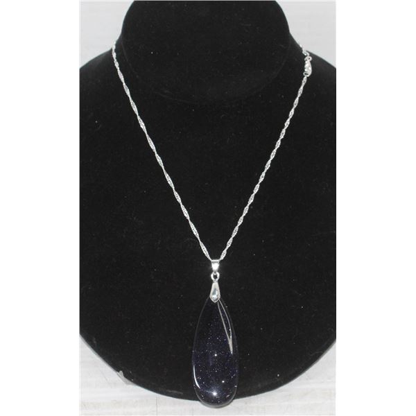 29)  ELONGATED TEAR DROP BLUE GOLD STONE