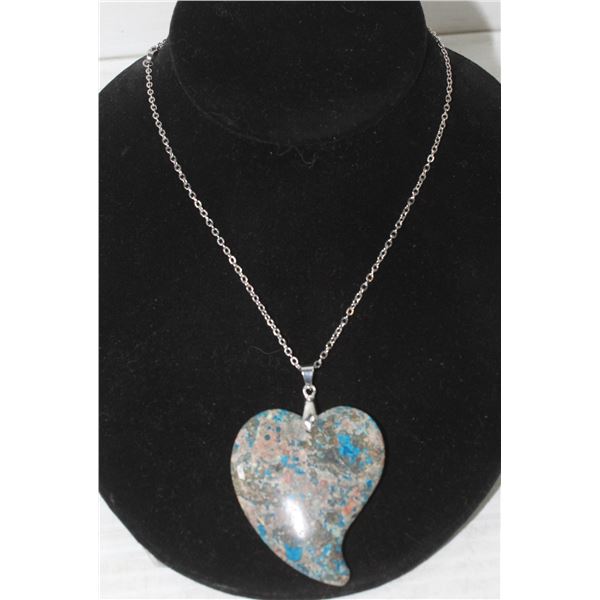 26)  FREE FORM HEART PENDANT OF NATURAL