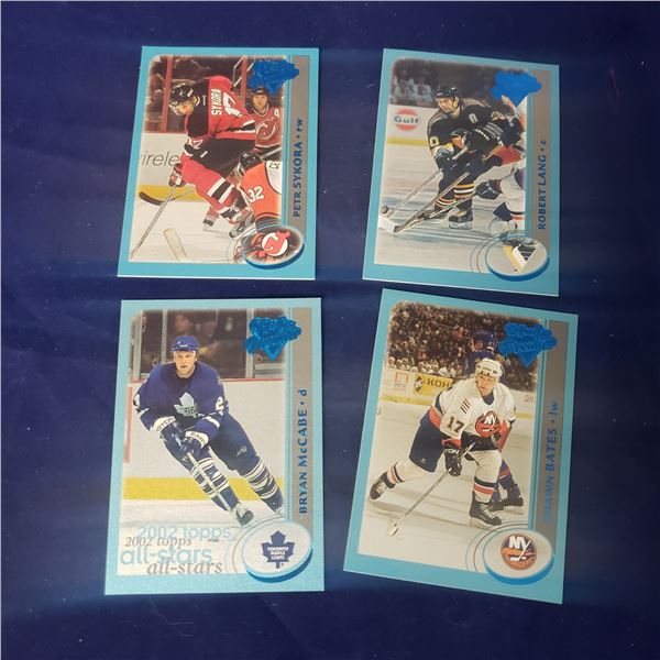four Serial numbered insert hockey cards