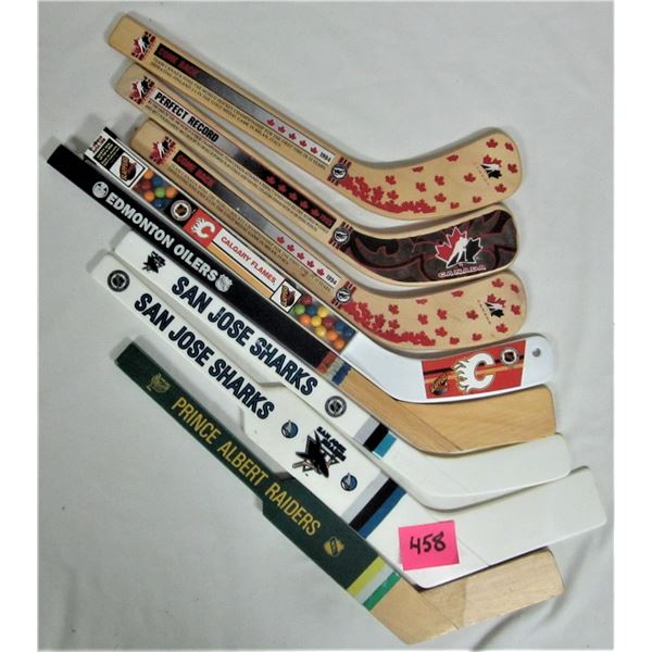 8 mini wooden & plastic souvenier hockey sticks