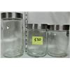 Image 1 : Set of 3 clear glass canisters with silver colored lids