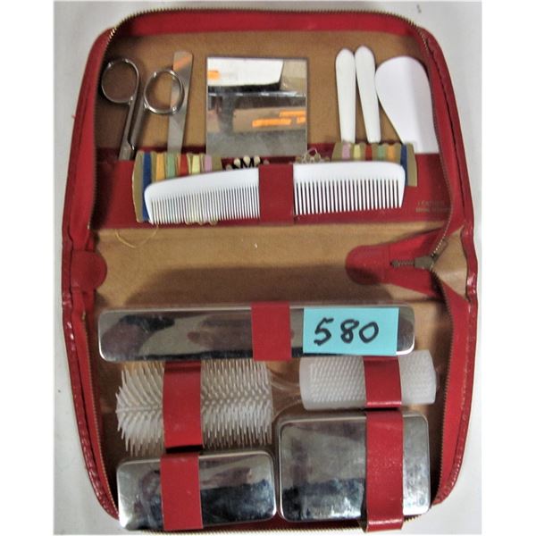 Vintage ladies travel toiletry set and red zippered leather case
