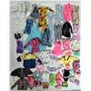 Image 4 : 4 Barbie dolls and assorted genuine Barbie clothing and accessories