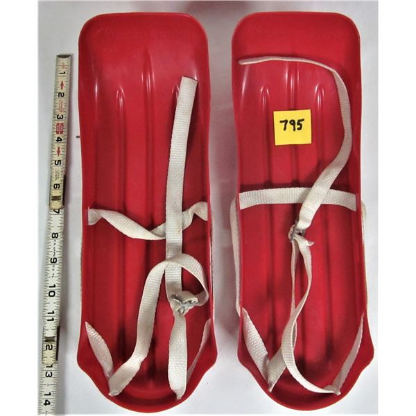 Vintage 1975 K-tel red plastic snow skates and bindings