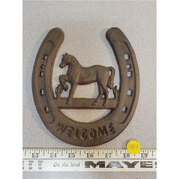 Iron horseshoe welcome sign