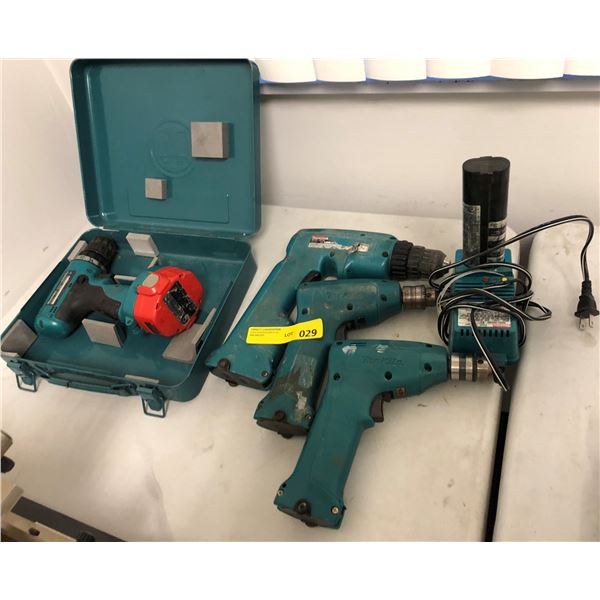 Group of 4 Makita power drills w/ battery charger