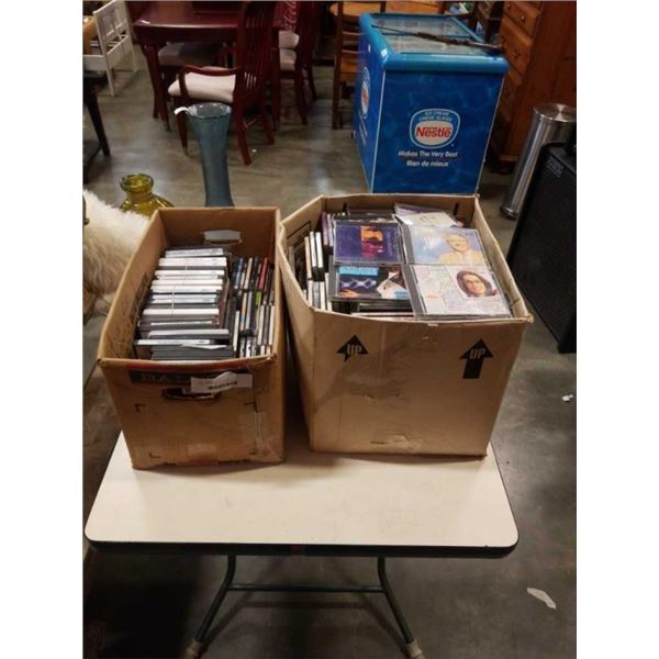 BOX OF CDS AND BOX OF DVDS