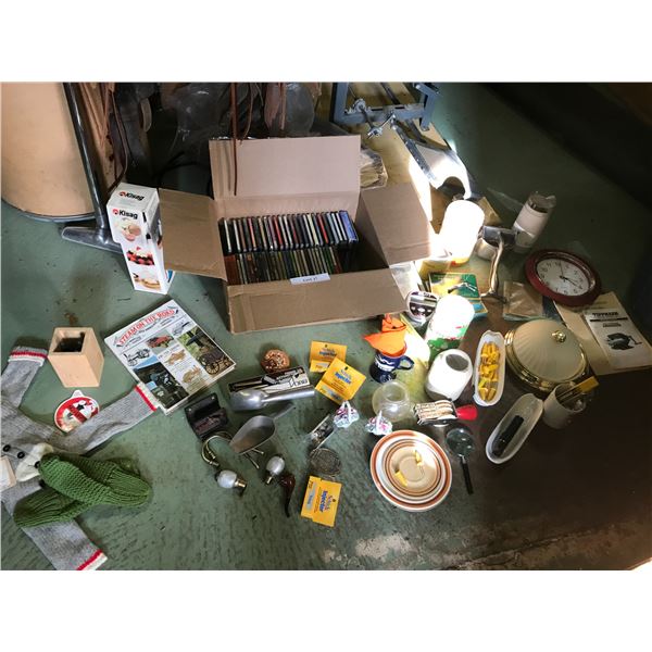 Huge lot of asst CD's, Schick injector, asst kitchen tools, dishes, empty tins, blender, garlic pres